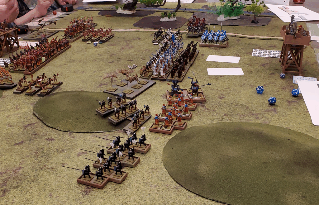 The first Legions of Tekumel battle at North Texas RPG Con 2025. Tsolyani and Mu'ugalavyani forces advance on each other.
